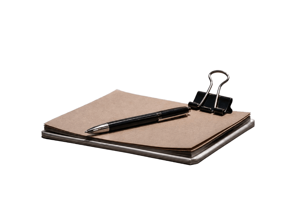 notebook with pen and binder clip